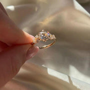Conflict-Free Round Moissanite Ring with Side Stones